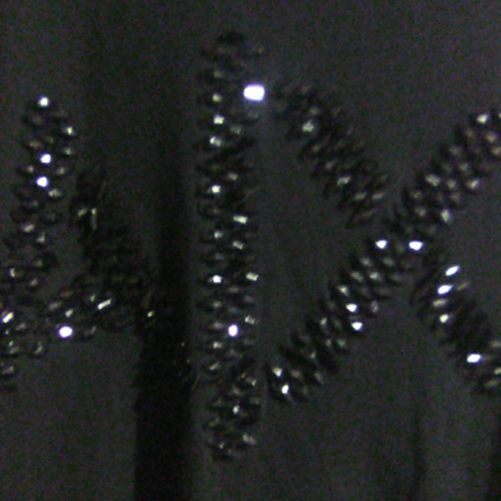 Armani t with sequins Armani symbol on front